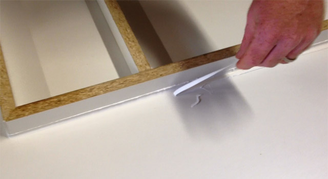 Pull off excess (dried) caulking to reveal the perfect edge