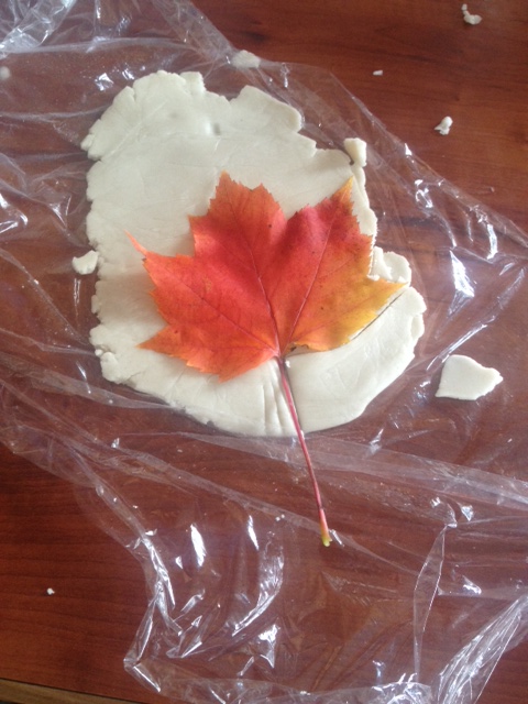 Using nature for decorative inspiration. Tracing a maple leaf to decorate the gluten free pumpkin pie.